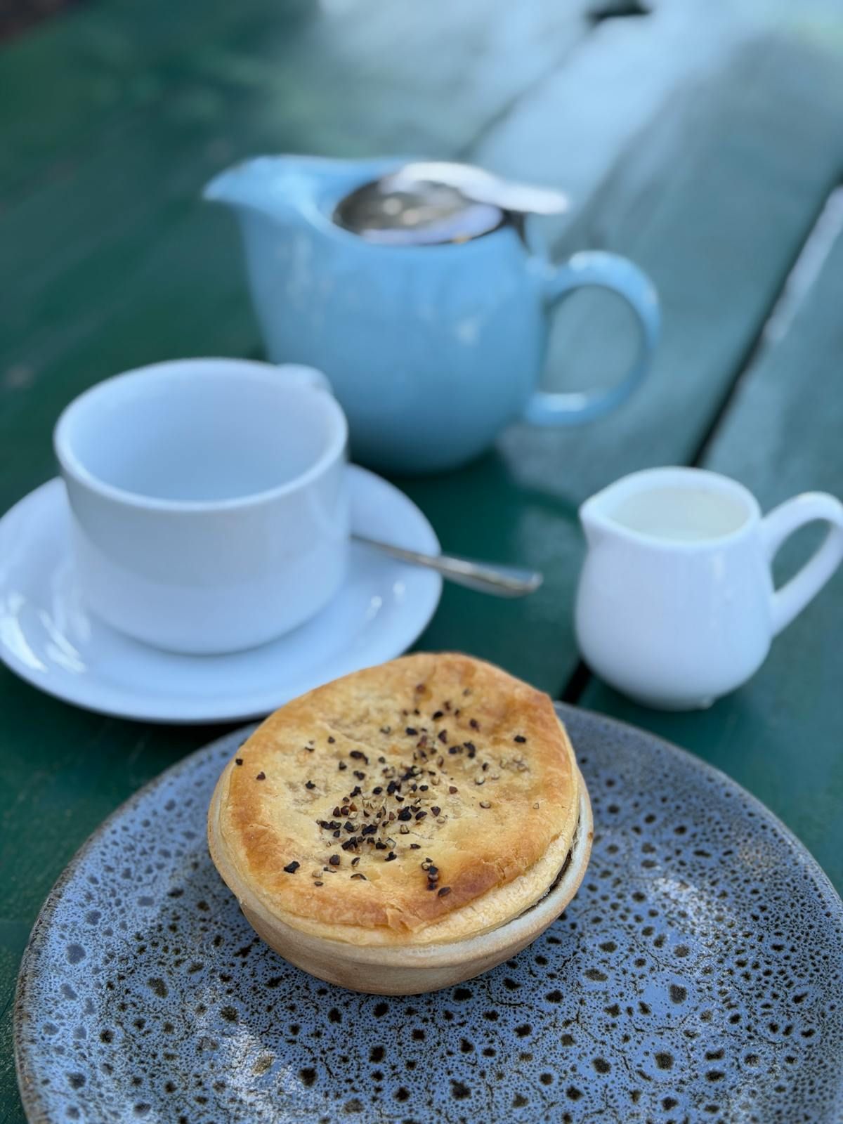 Cross-section of a beef and mushroom pie showing the rich, glossy filling.