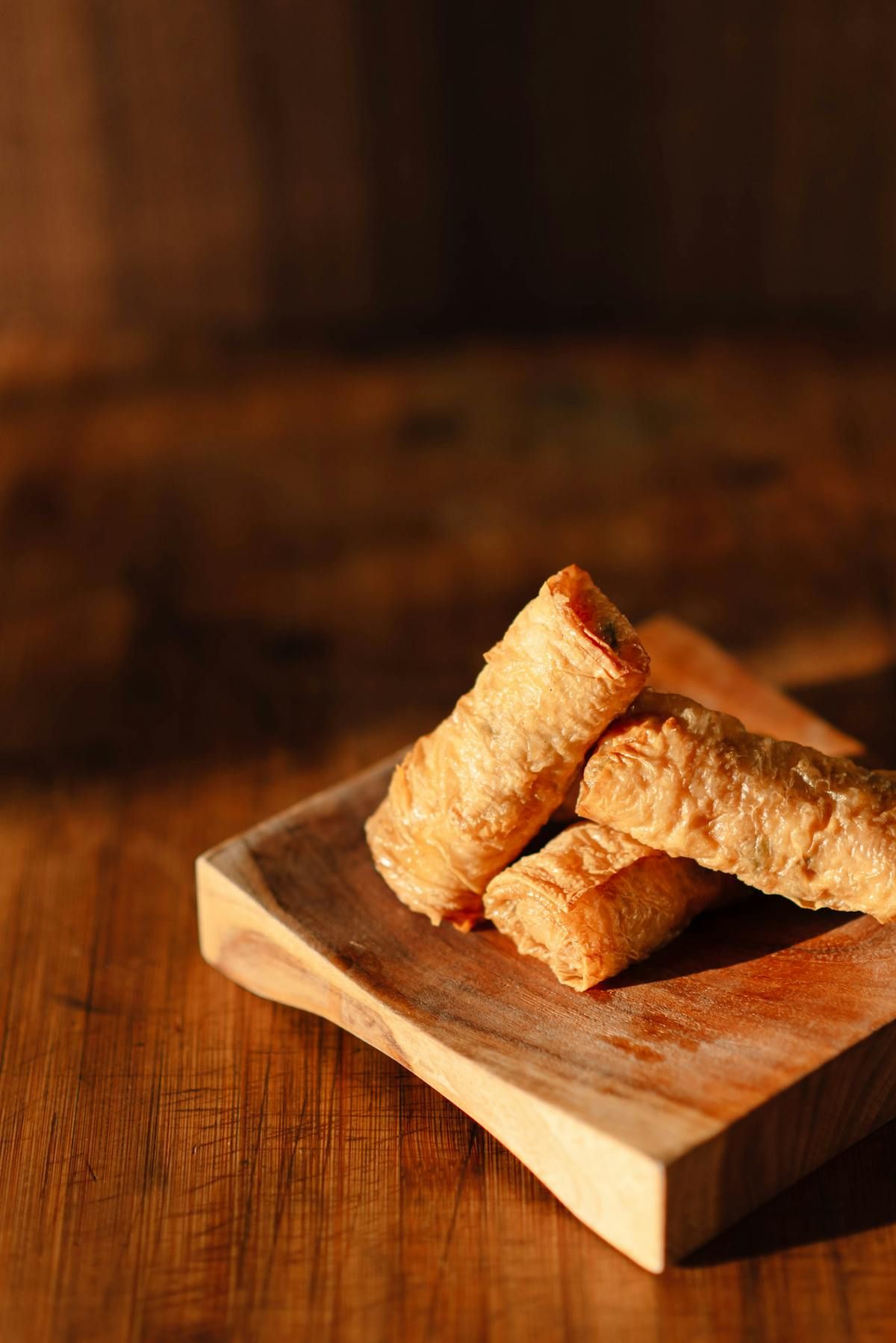 A golden, flaky sausage roll loaded with mashed potato, mushy peas and gravy.